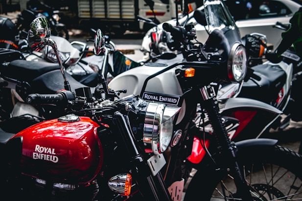 gray and red Royal Enfield motorcycles