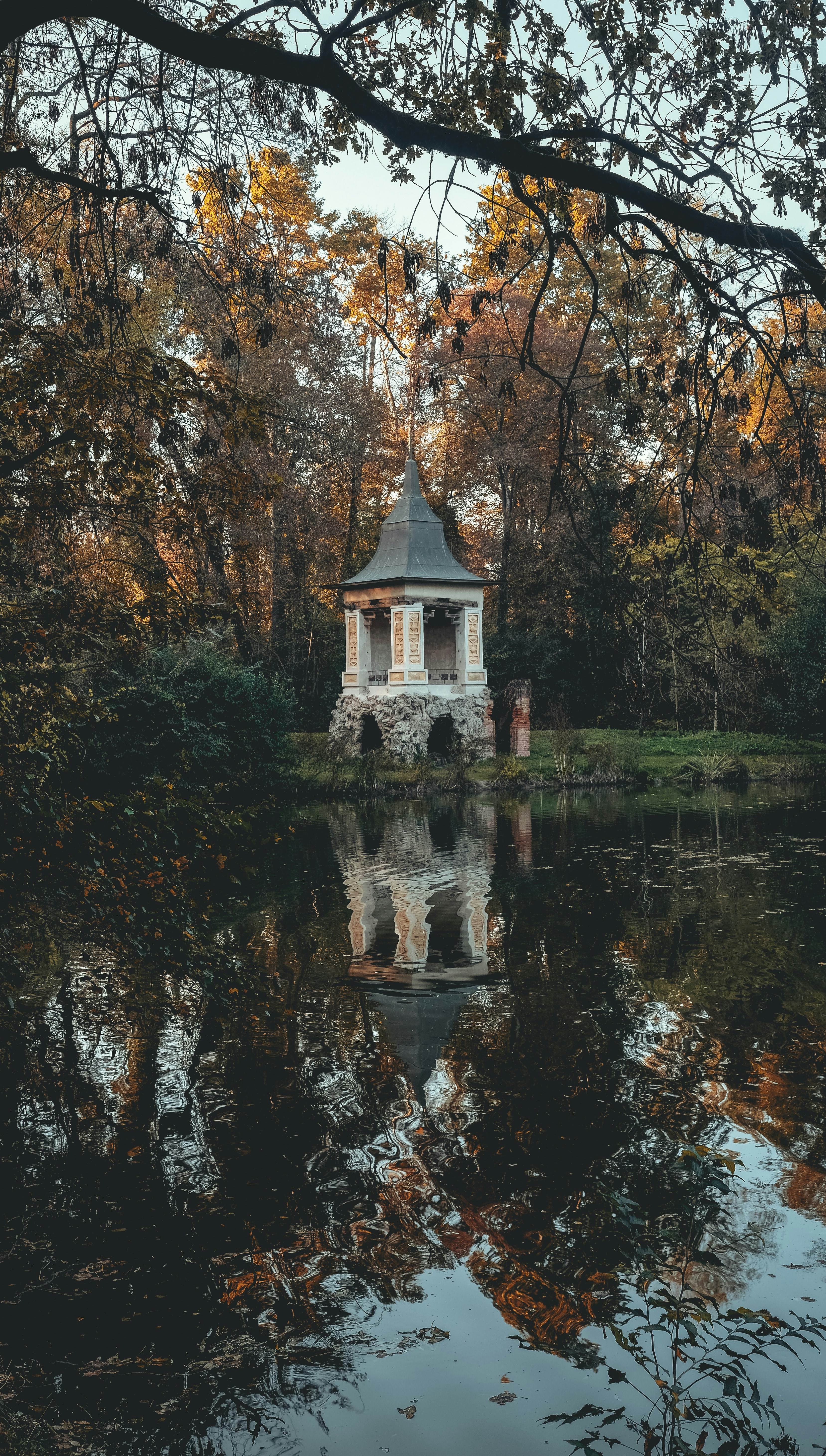 white pagoda facing body of water