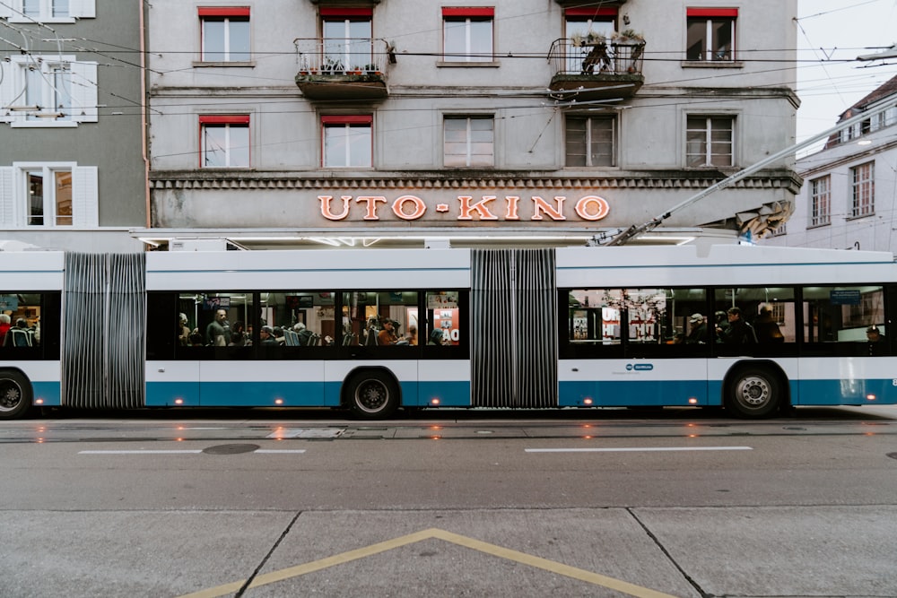 white and blue bus