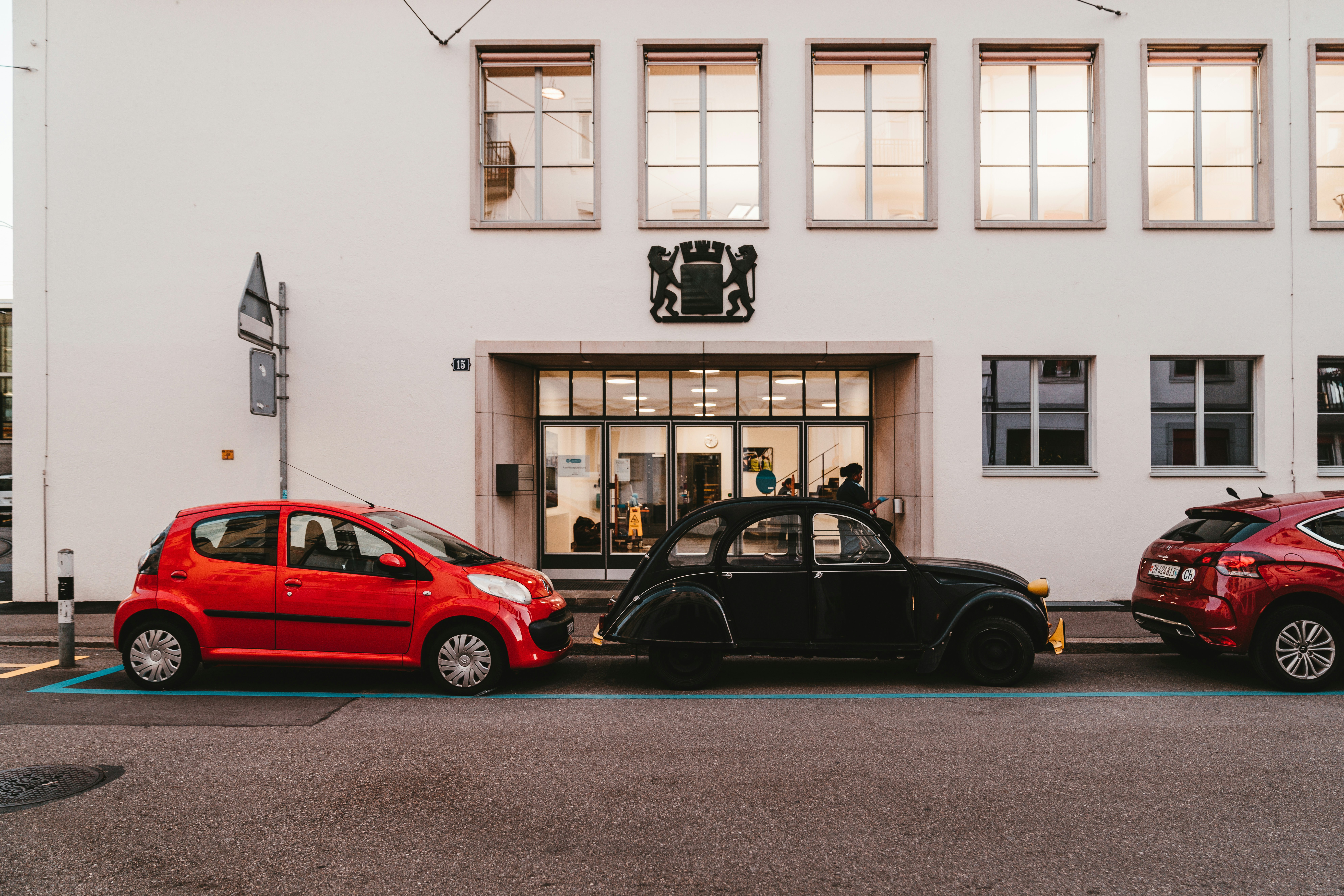 two black and red hatchbacks
