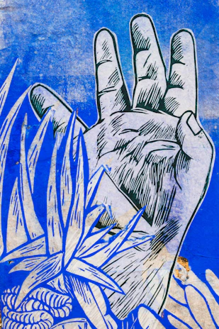 Close-up of hands sketching a metaphorical card with golden and navy blue tones