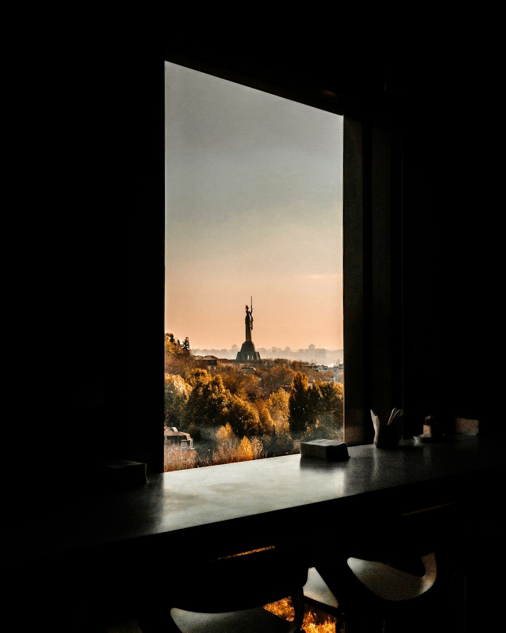 black wooden table near window panel