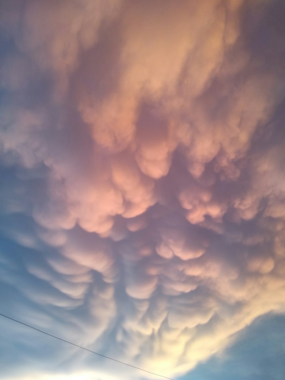 a group of clouds that are in the sky