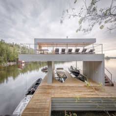 Modern luxury boat dock with upper patio on Lake Joseph.