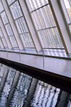 Artistic glass panels reflecting sunlight in a contemporary setting.