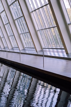 Artistic glass panels reflecting sunlight in a contemporary setting.