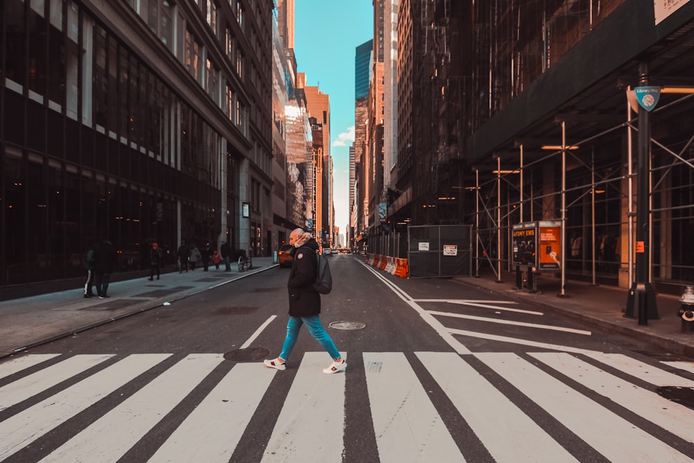 woman walking on pedestrian lane