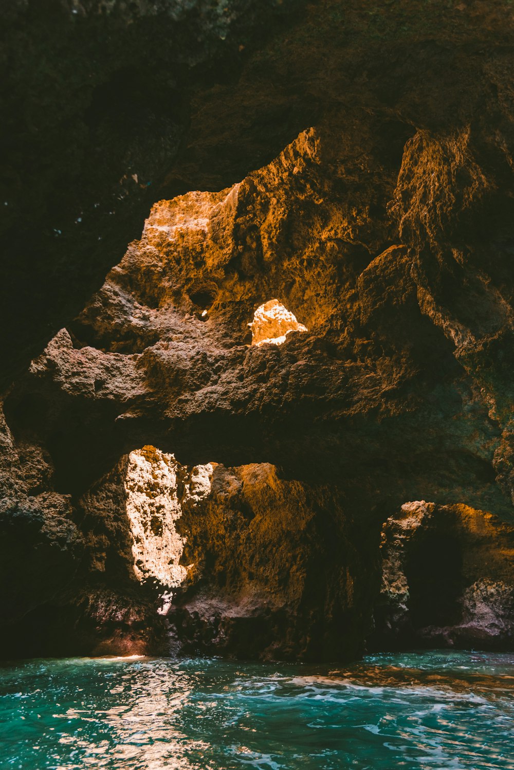 body of water under cave