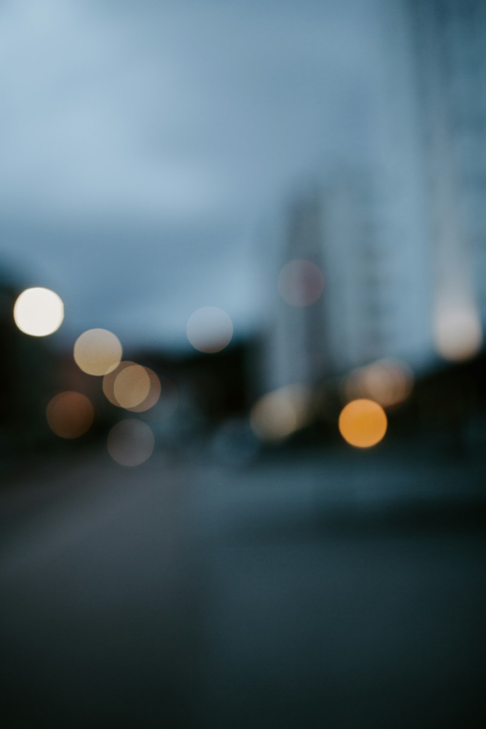 a blurry photo of a city street at night