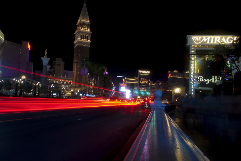 a city street filled with lots of traffic at night