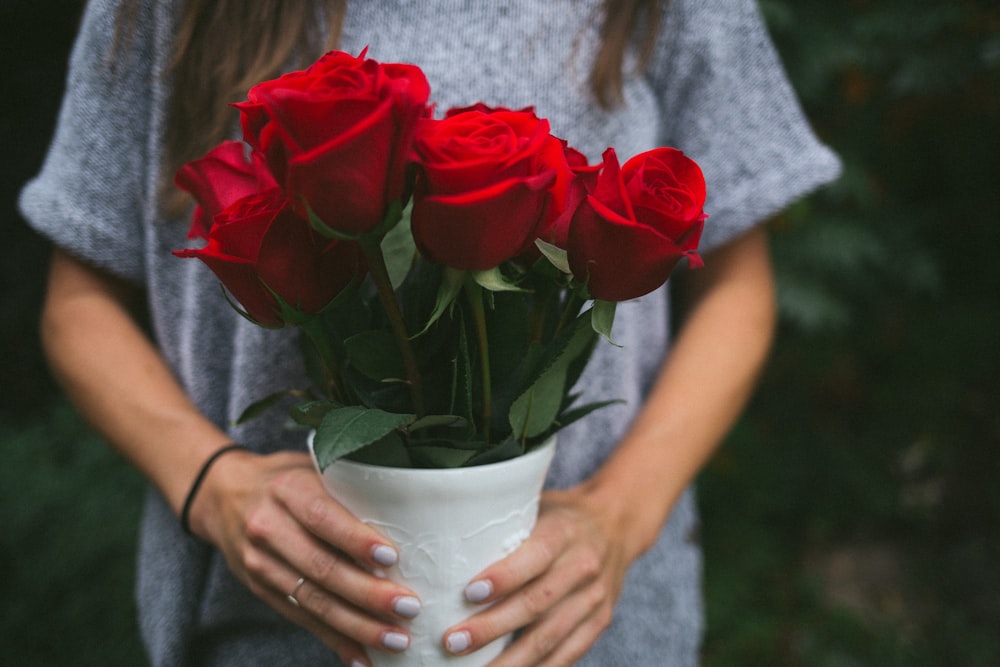 person holding flower bouquet