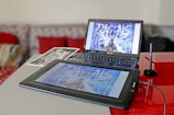 gray tablet computer and Asus laptop