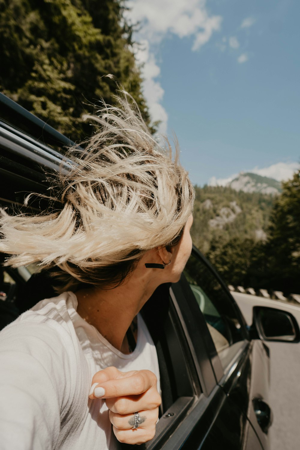 woman riding black vehicle