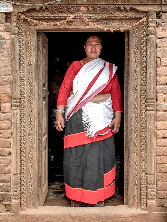 woman standing on door in Kirtipur Nepal