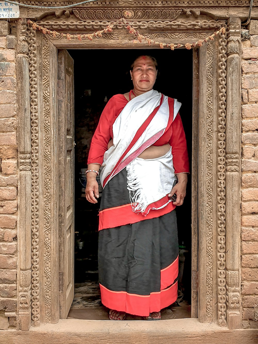 woman standing on door