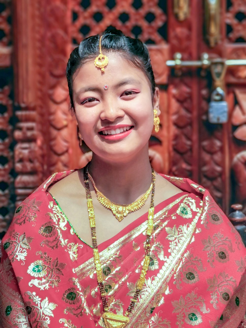 woman wears pink sari dress