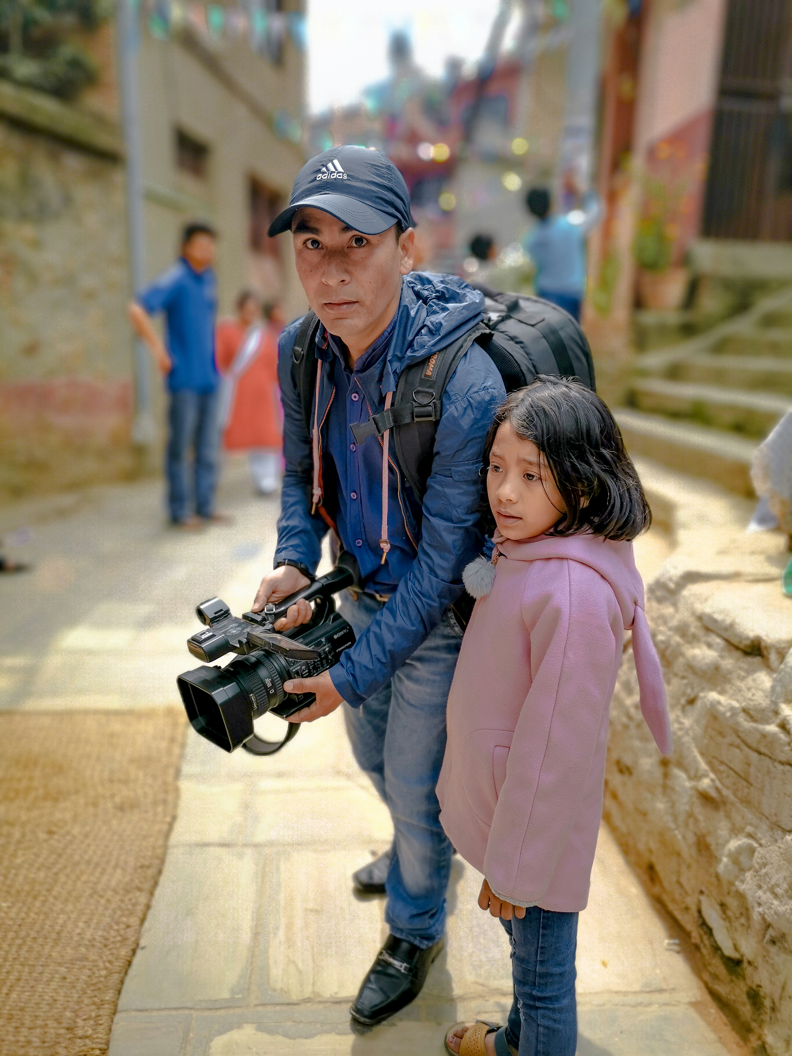 man holding black video camera