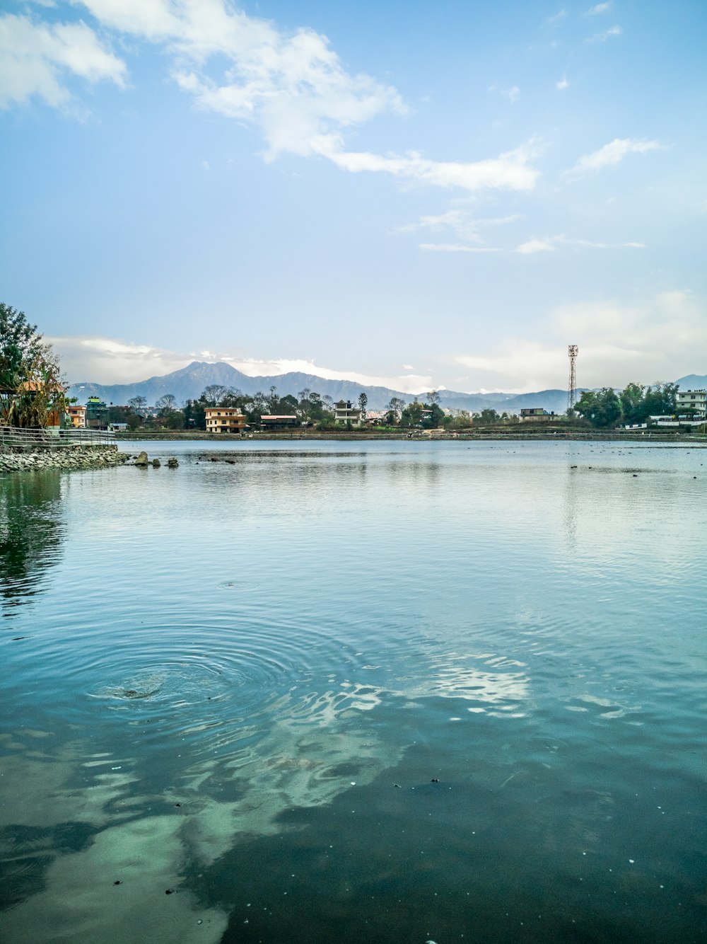 blue body of water under white clouds photograph