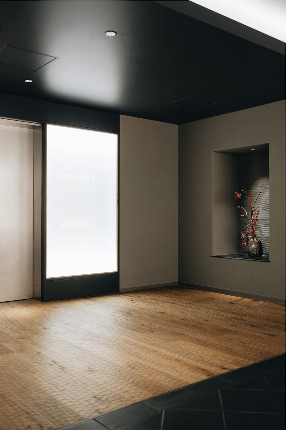 brown wooden floor and white walls