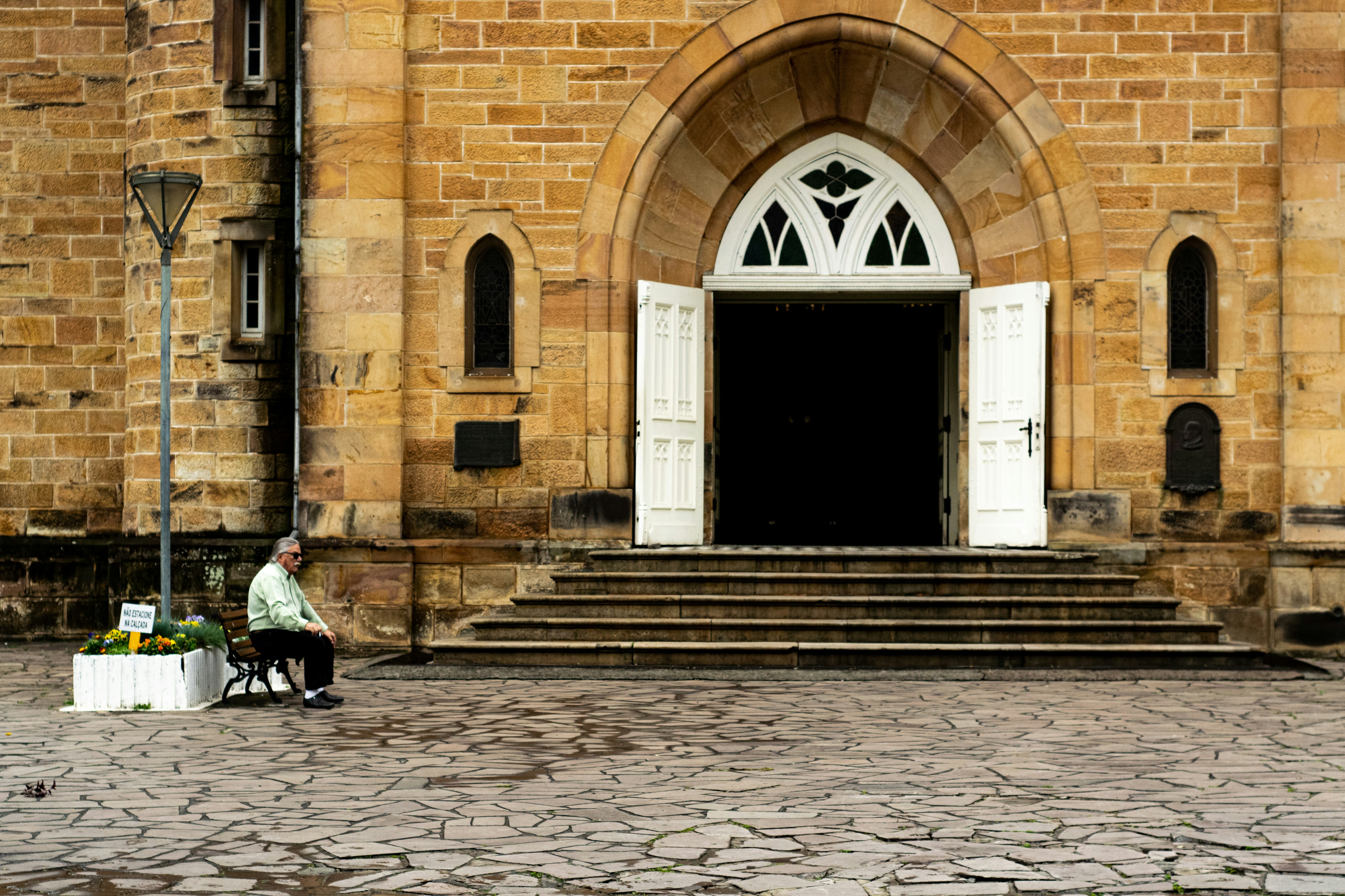 man sitting on brown chair