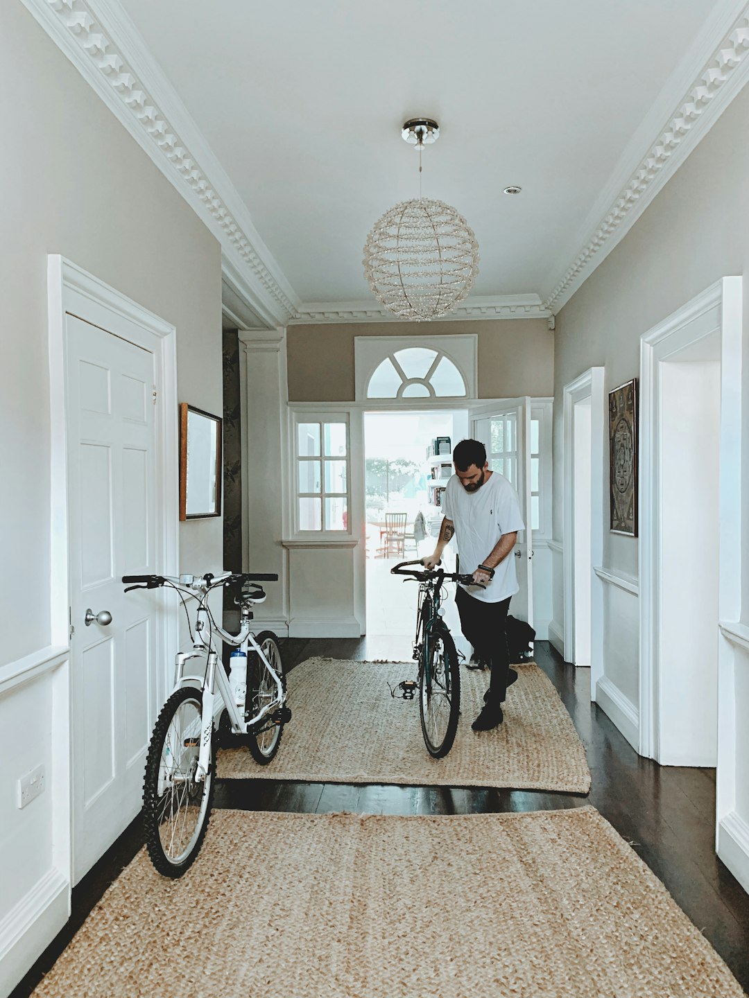 man holding bicycle