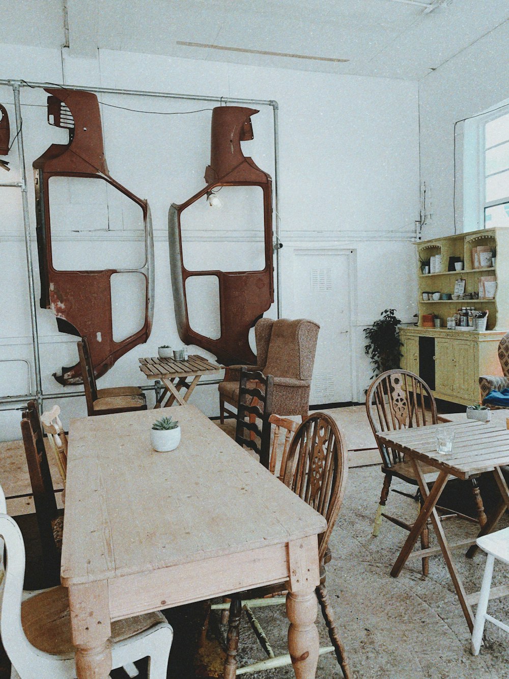 brown wooden table with white pot