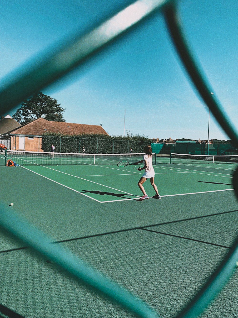 woman playing tennis on court