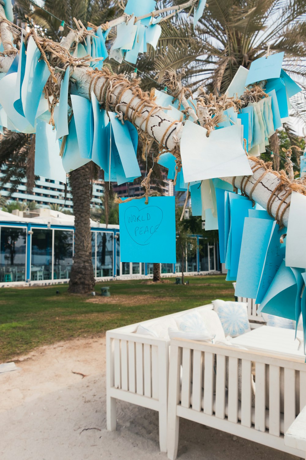 sticky notes on tree and white wooden bed frame