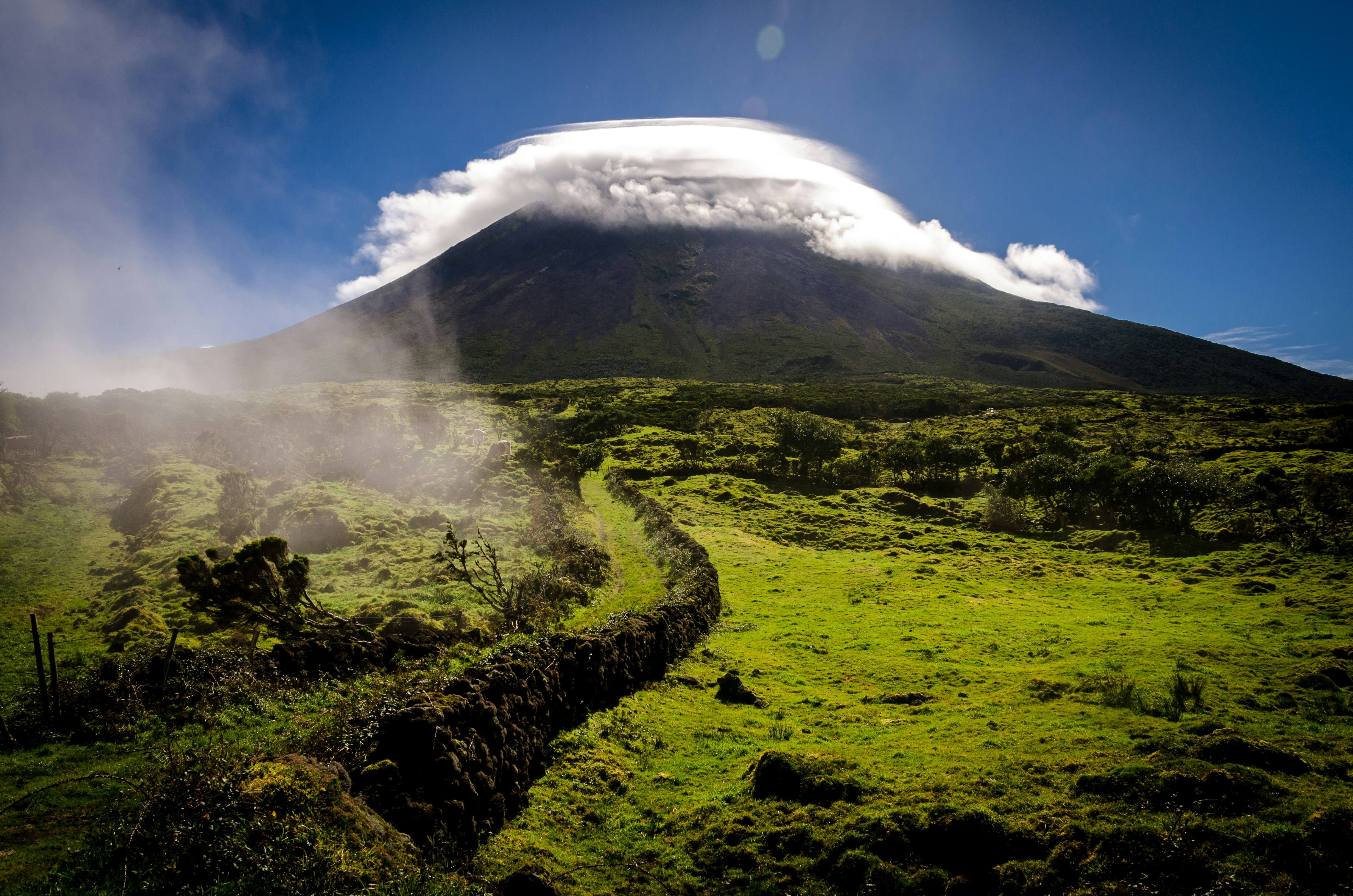Grass field through volcano photo – Free Green Image on Unsplash