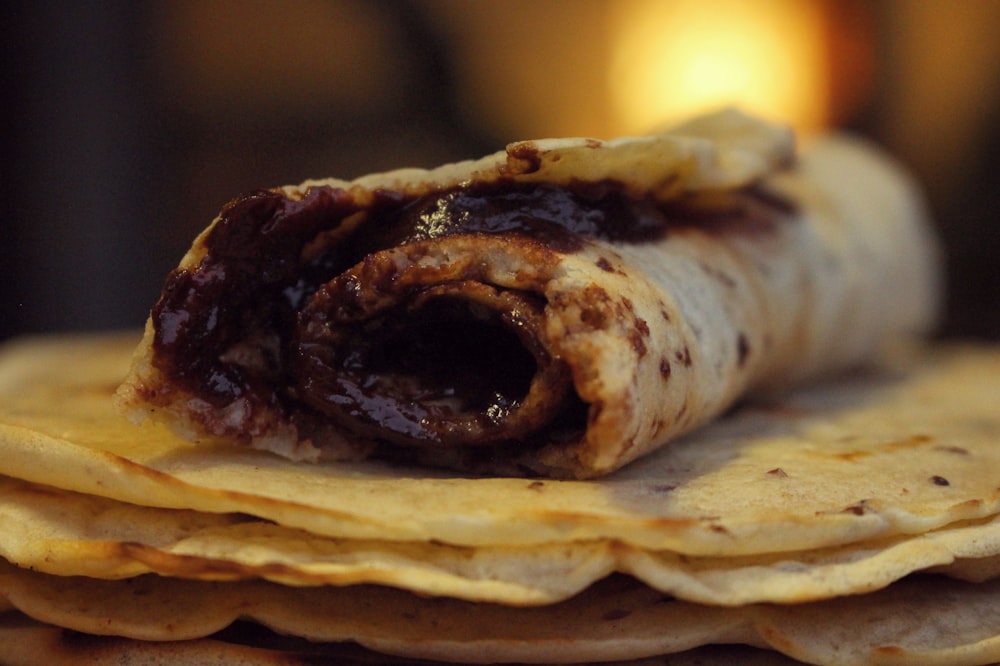 selective focus photo of roti with chocolate
