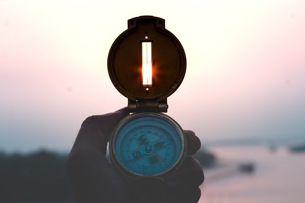 round gold-colored and white compass