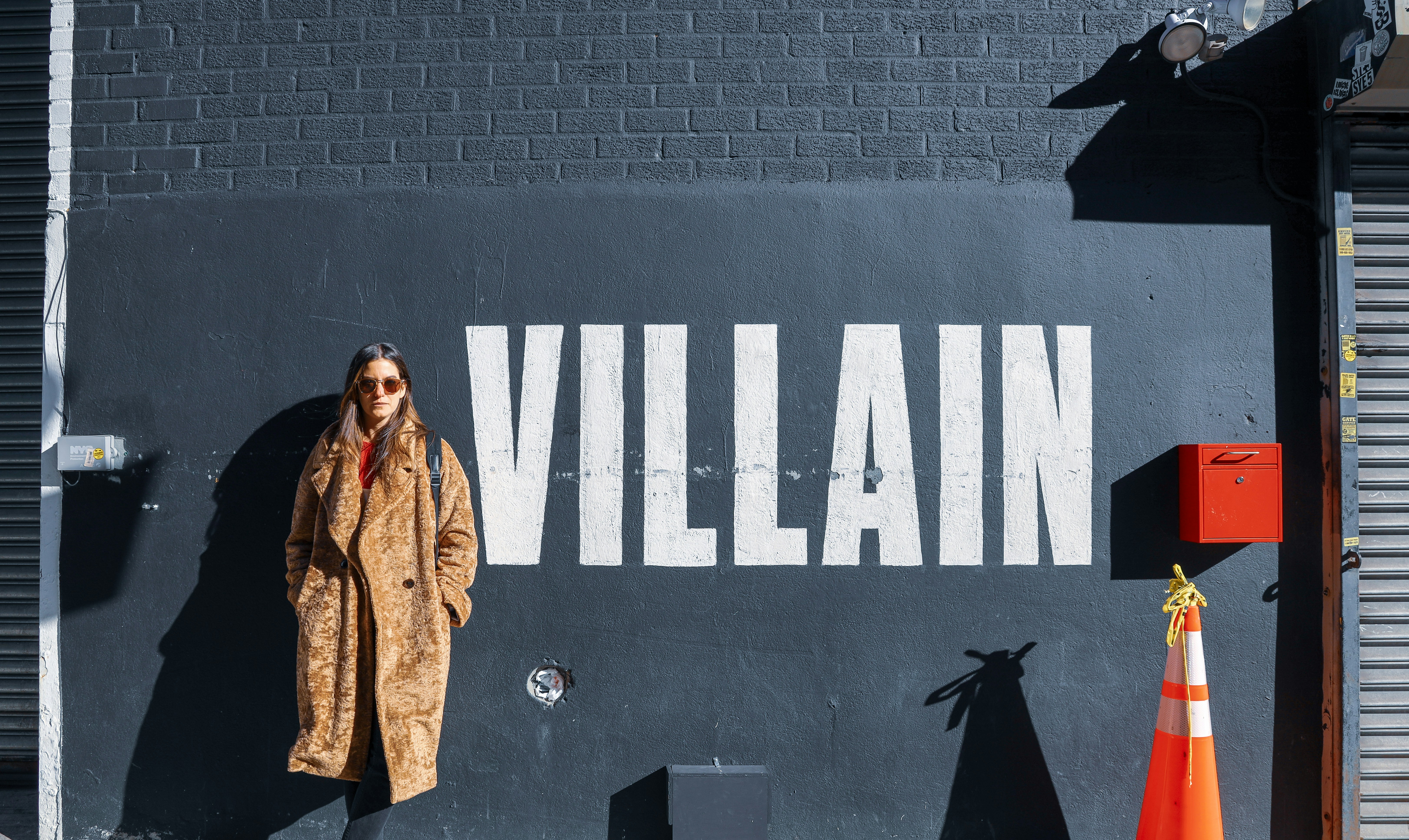 woman standing near wall, Brooklyn Villain</p><p>Took this photo in Manhattan was inspired by text & texture at Brooklyn wall</p><p>This photo was taken as part of the #Unsplash awards #street challenge. 