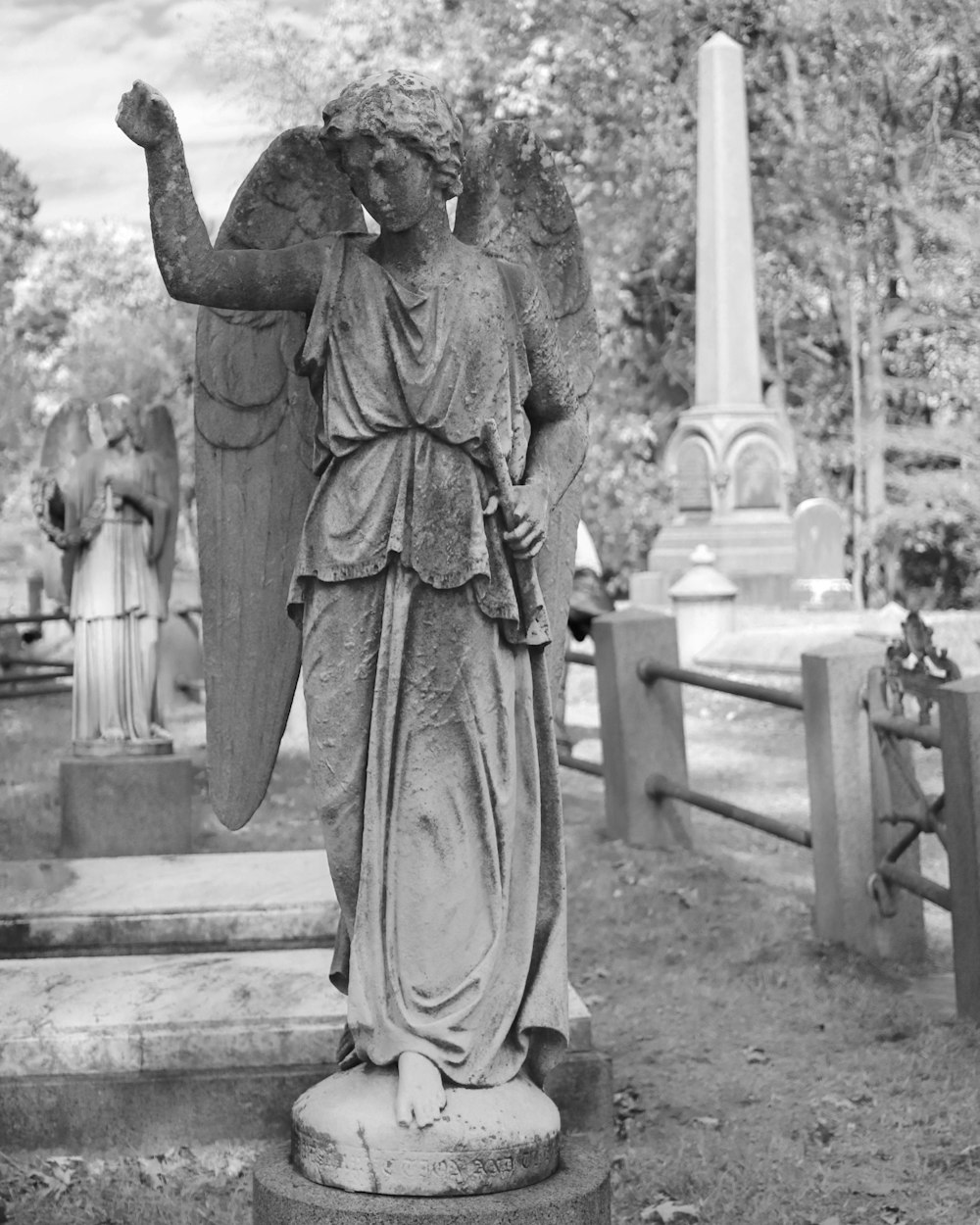 grayscale statue of an angel