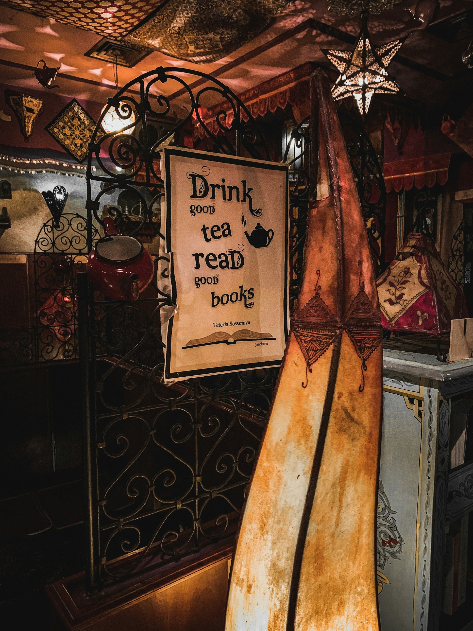 Cozy interior of a charming tea house with wooden tables and soft lighting