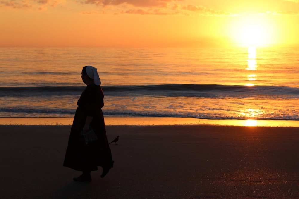 silhouette of woman wearing seashore