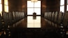 rectangular brown wooden table with chairs