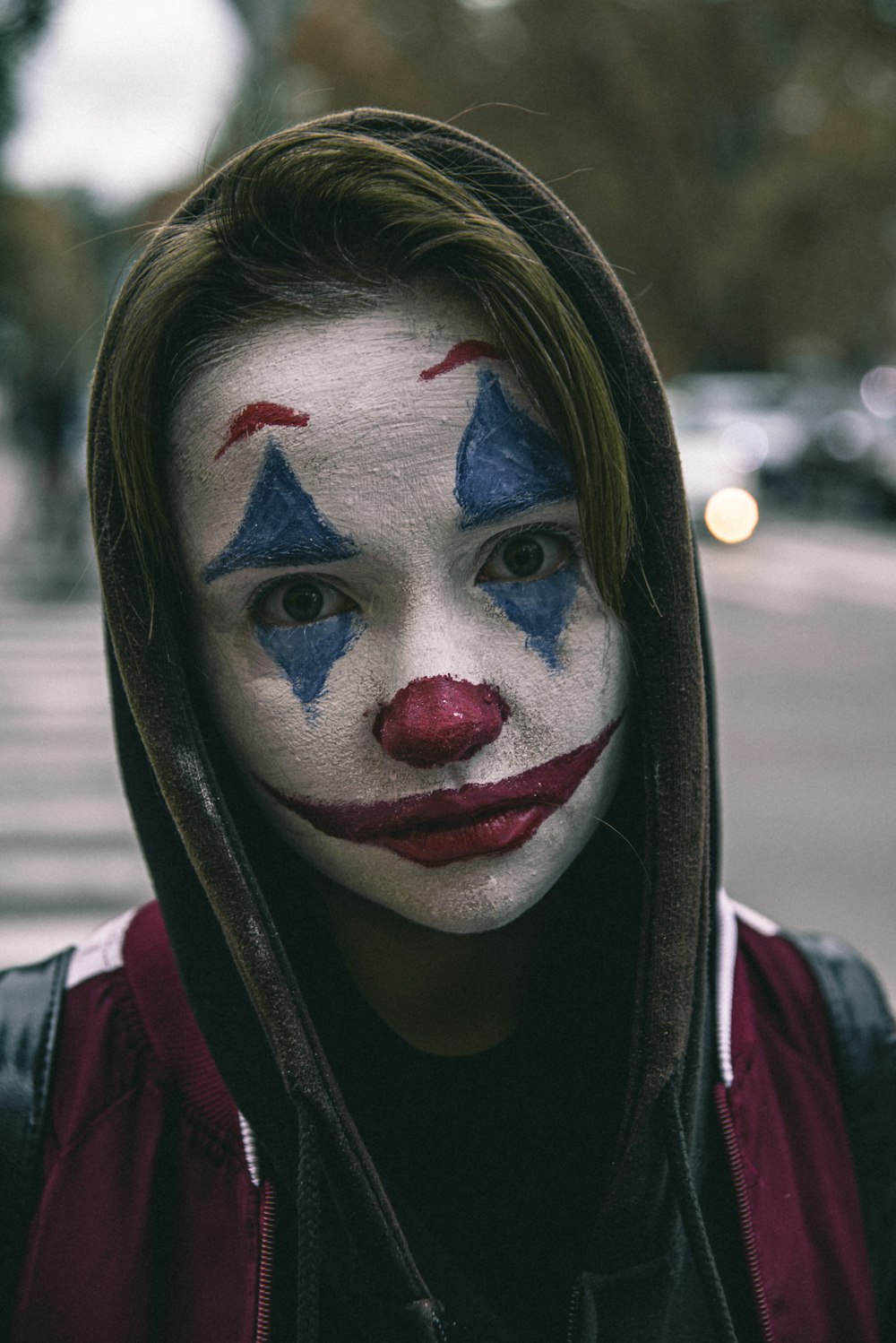 a person with a clown make up on their face