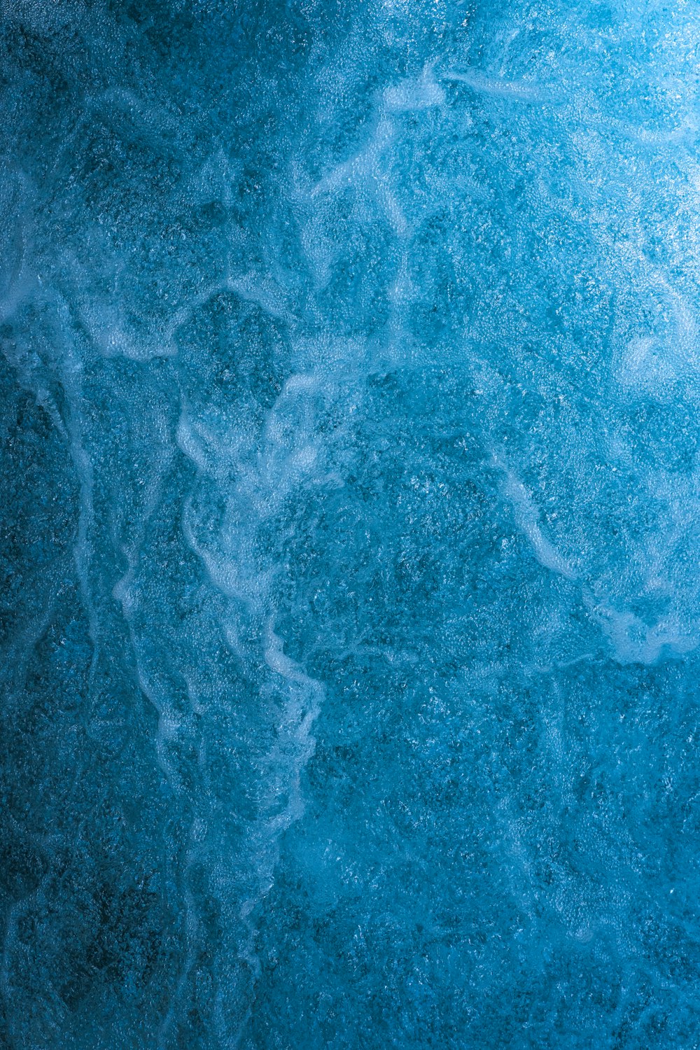 a close up of a blue water surface