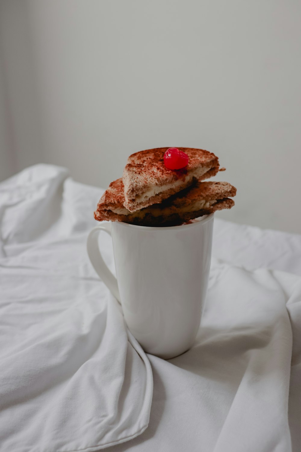 two sliced pie on white ceramic mug