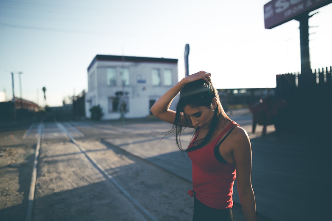 woman standing near house