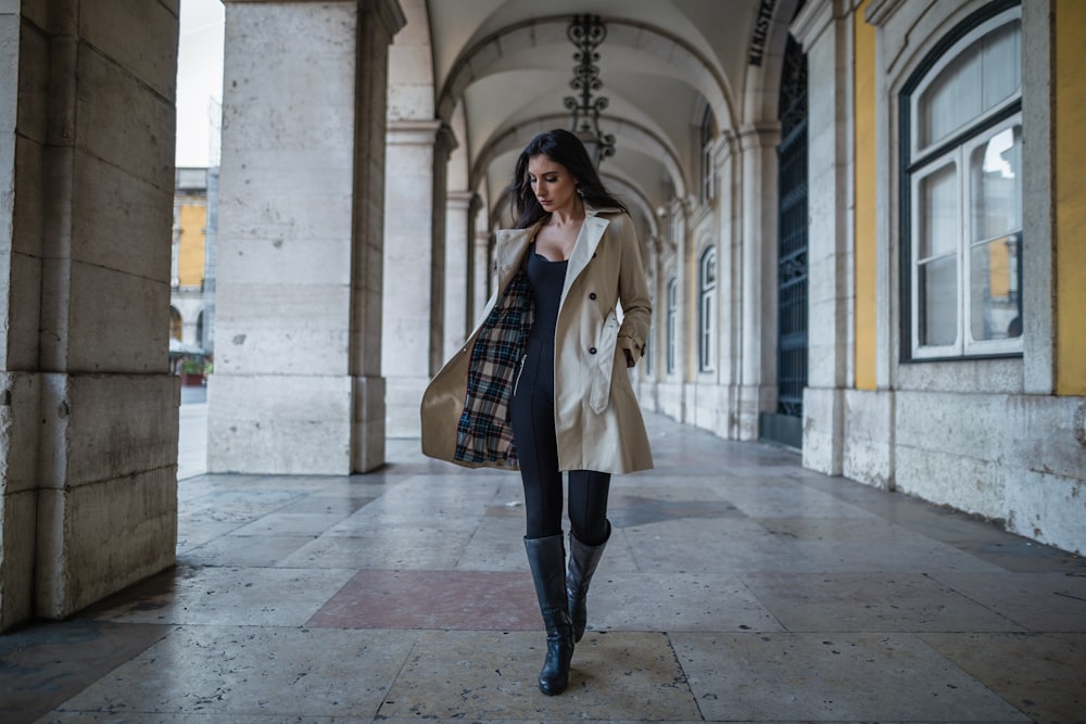 woman in a coat at a hallway