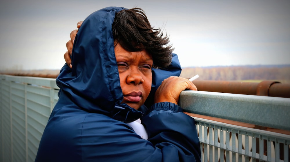 woman in blue coat