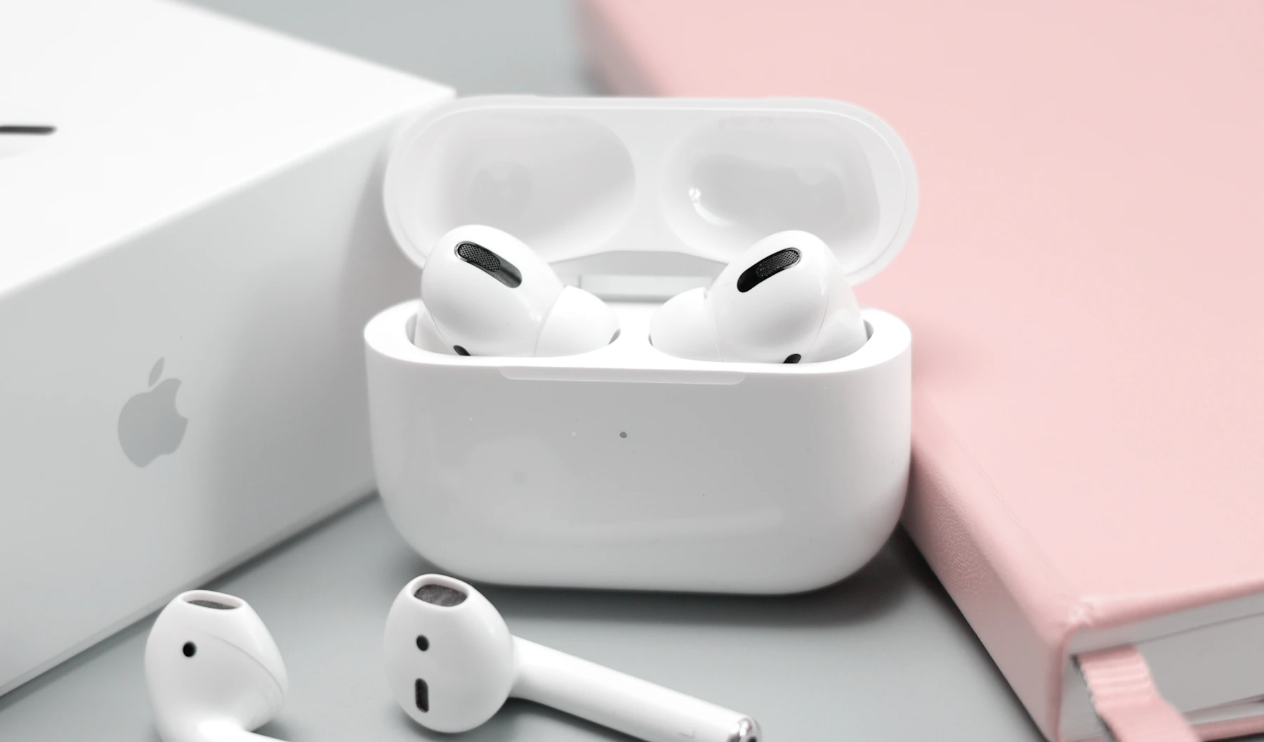 Wireless earbuds and charging case representing portable personal technology