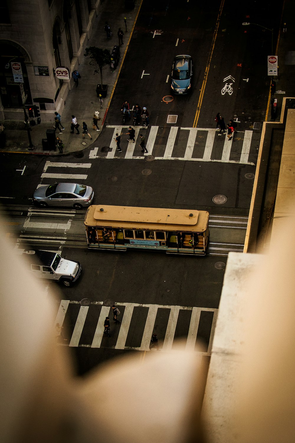 yellow bus on paved road