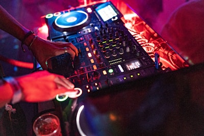 person using DJ mixer