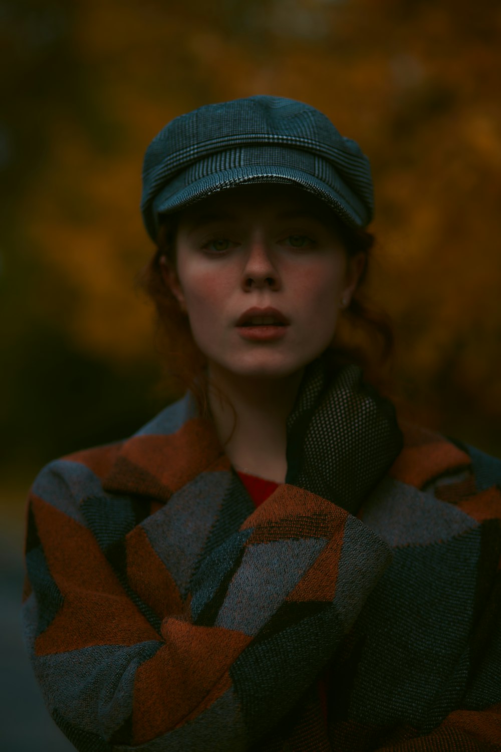 woman wearing black hat and brown sweater