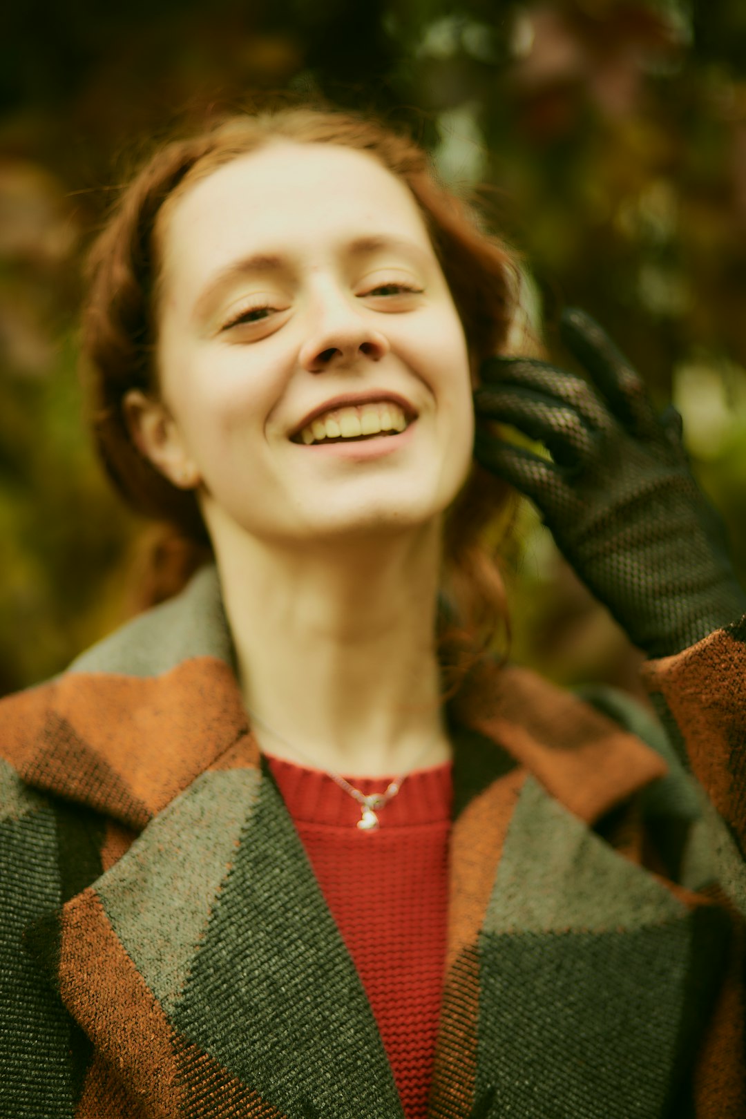 woman wearing green and brown jacket