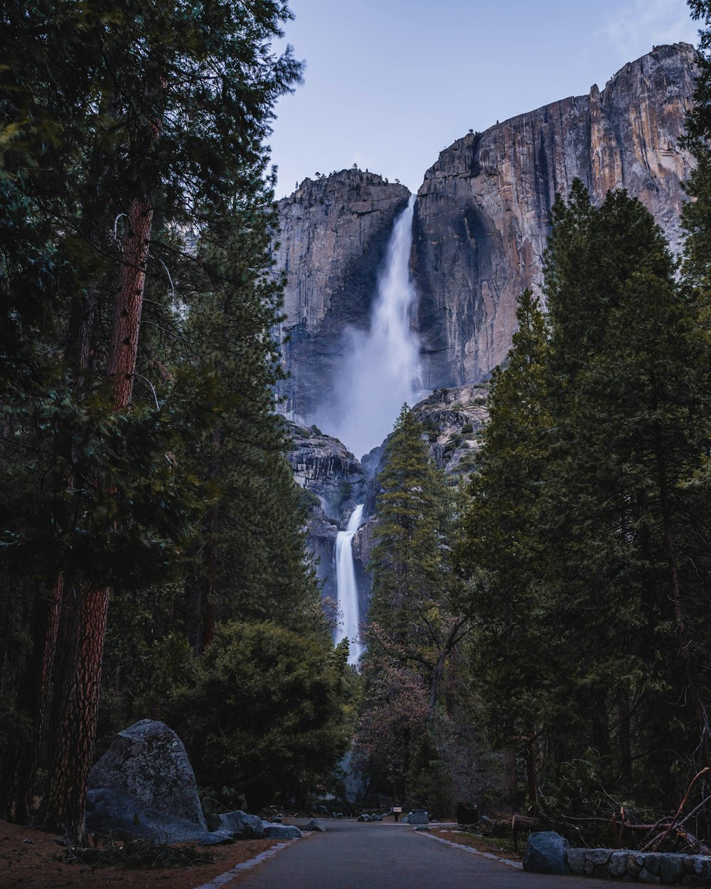 waterfalls flowing from hills during daytime