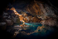 A breathtaking underwater cave illuminated by sunlight.