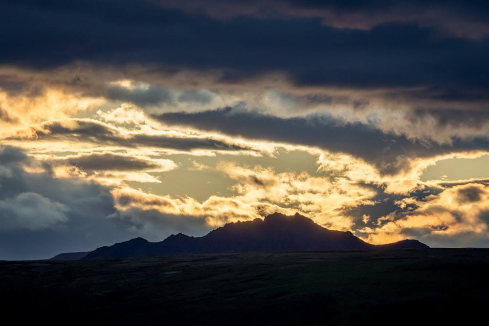 silhouette of a mountain at sunrise